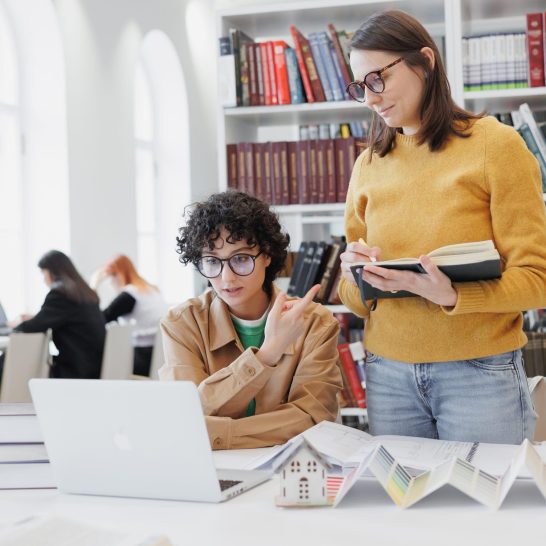 two-female-colleagues-work-laptop-designers-architects-discuss-project-successful-female-students-scaled-1.jpg